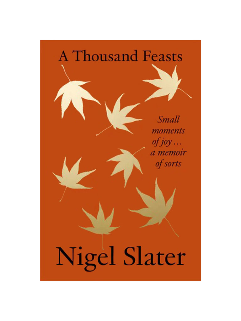 orange book cover with golden maple leaves floating down with 'a thousand feasts' in black text at the top