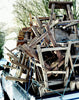 a pile of old elm stools stacked on the back of a truck