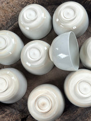 white ceramic bowls on timber surface
