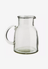 a larger glass jug, with a sturdy base and handmade handle. ideal as a water jug.
