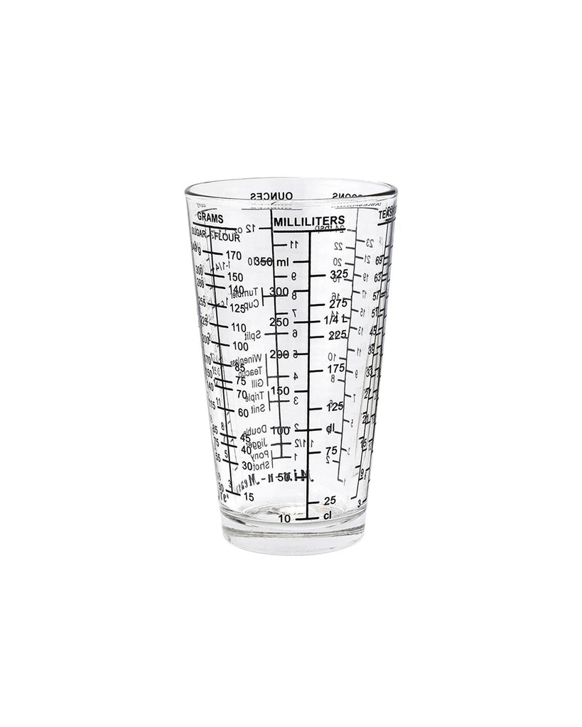 Clear glass measuring cup with milliliter markings on a white background