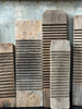 Assorted sizes and styles of weathered washboards. Washed out white wood to darker brown. Shows detail of ridges in the middle used for washing and smooth ends.