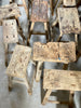 Assortment of old elm stools in different styles.