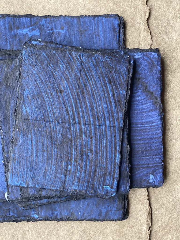 bundles of indigo paper