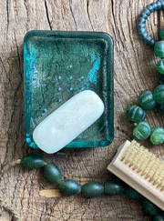 Blue-green, recycled glass, thick soap dish. Soap shaped indent and knobbles to secure soap.