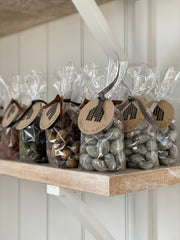 bags of delicious chocolates, tied with ribbon and a brown baileys label.